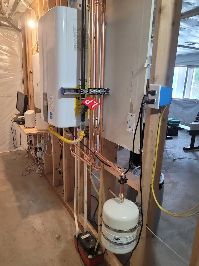 Licensed plumber repairing a kitchen sink in Sumner
